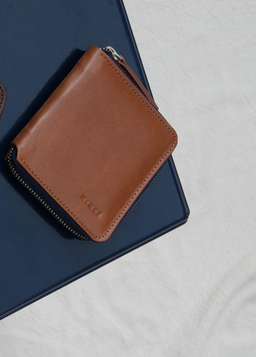 Brown leather wallet with navy zipper