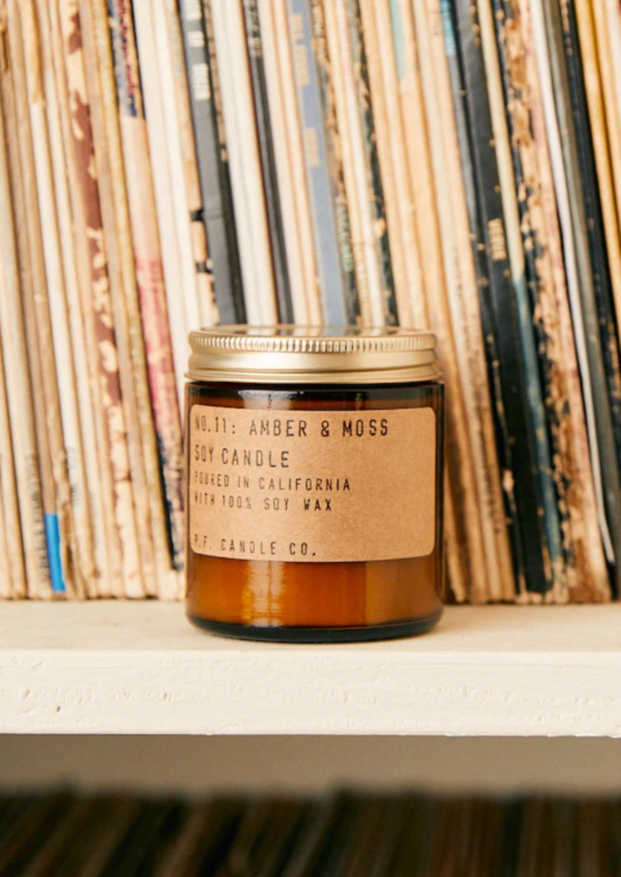 Candle in an amber glass jar