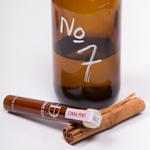 Glass bottle with toothpicks inside it.