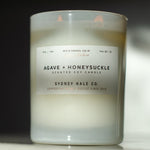 Candle in frosted white glass vessel