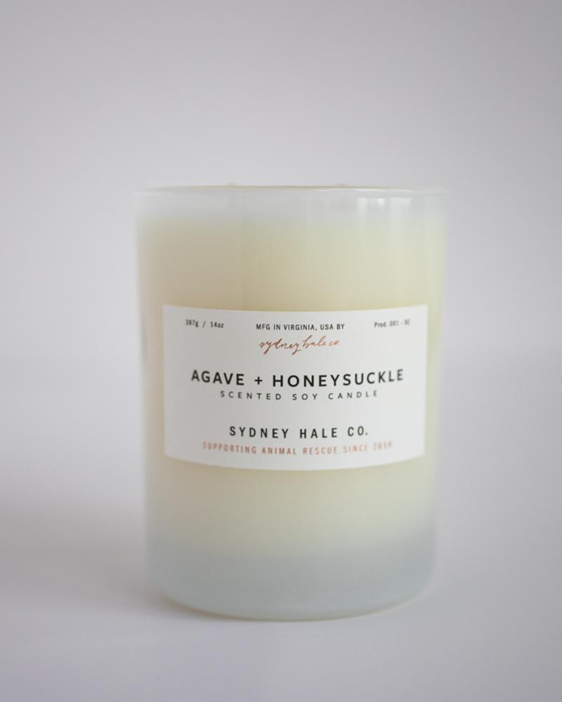 Candle in frosted white glass vessel
