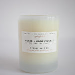 Candle in frosted white glass vessel