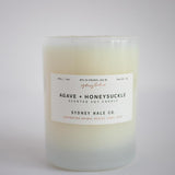 Candle in frosted white glass vessel
