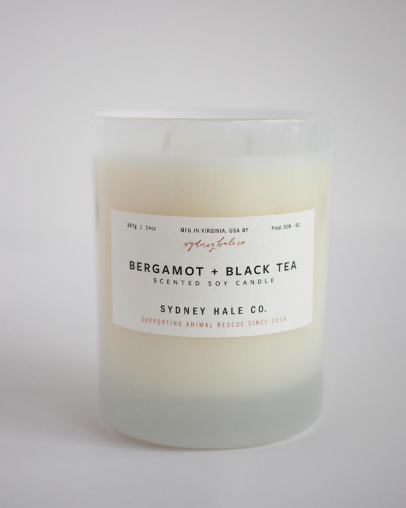 Candle in a frosted cream glass vessel