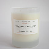 Candle in a frosted cream glass vessel