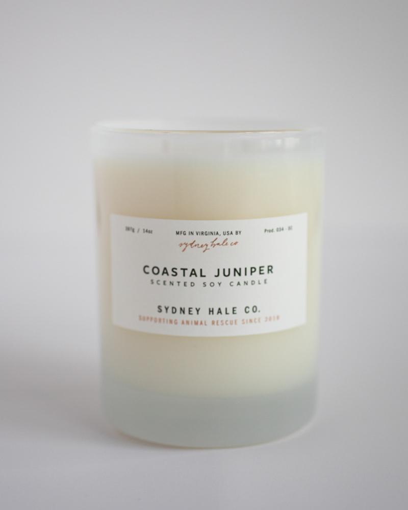 Candle in a frosted cream glass vessel