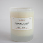 Candle in a frosted cream glass vessel