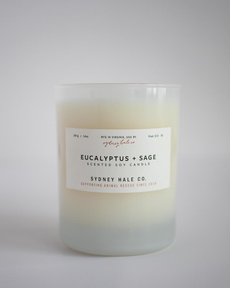 Candle in frosted glass vessel