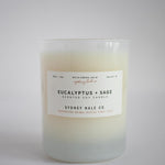 Candle in frosted glass vessel