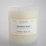 Candle in a frosted cream glass vessel