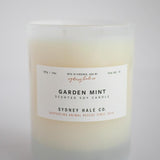 Candle in a frosted cream glass vessel