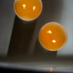 Candle in frosted white glass vessel