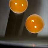 Candle in frosted white glass vessel