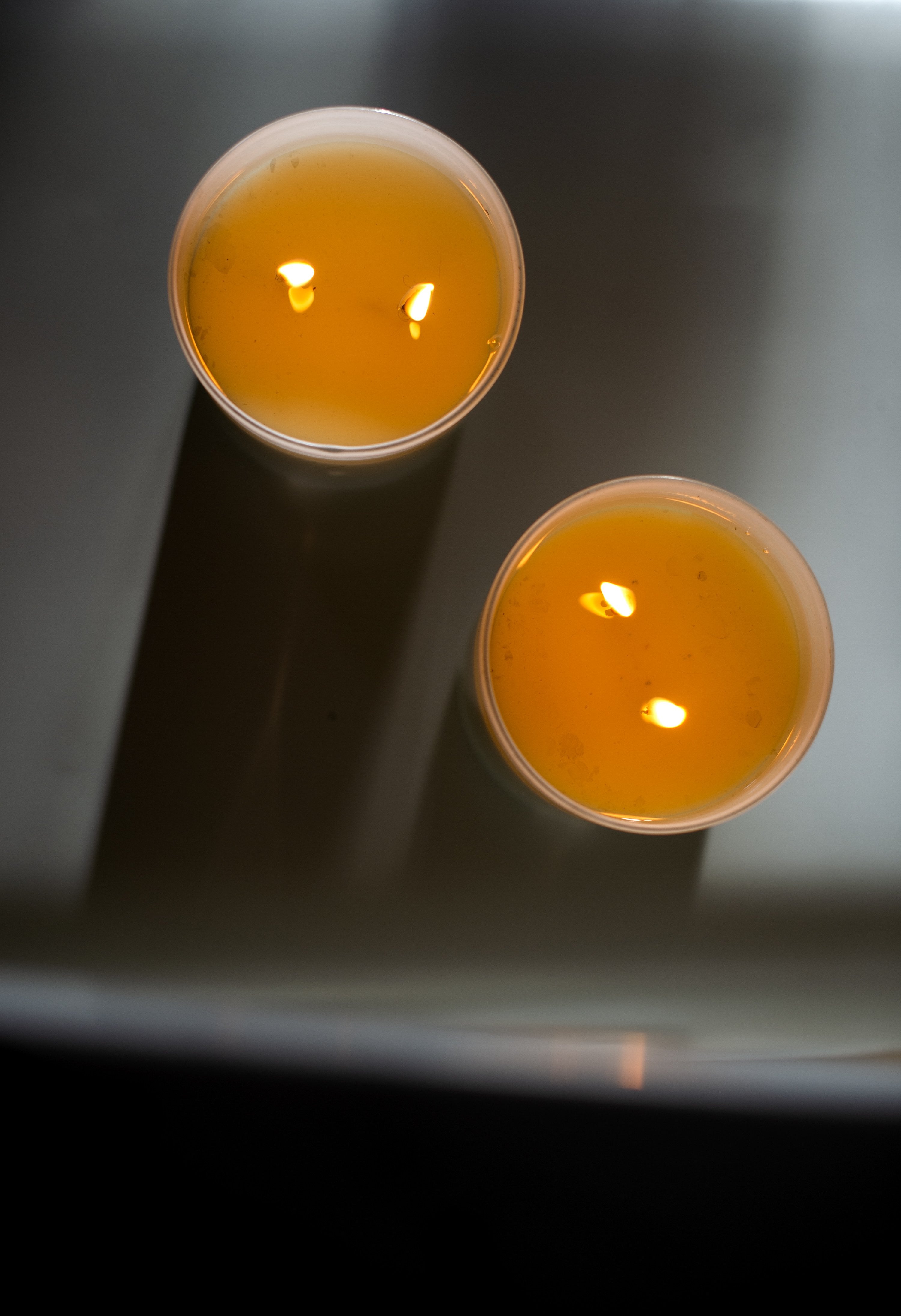 Candle in frosted white glass vessel
