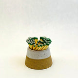 Ceramic match holder with matches