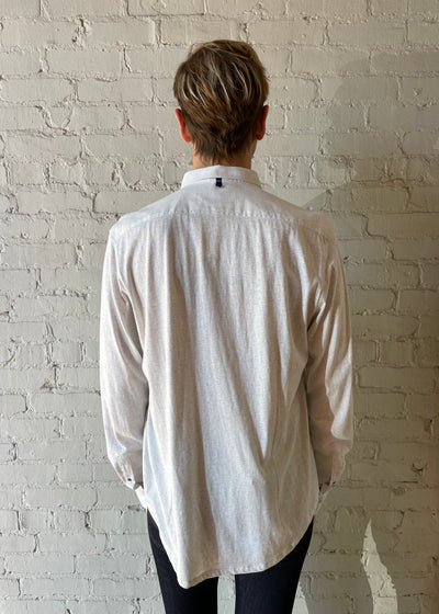 Man wearing White button up shirt and black jeans
