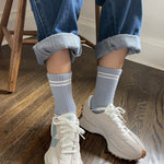 Powder blue crew socks with white stripe toppers