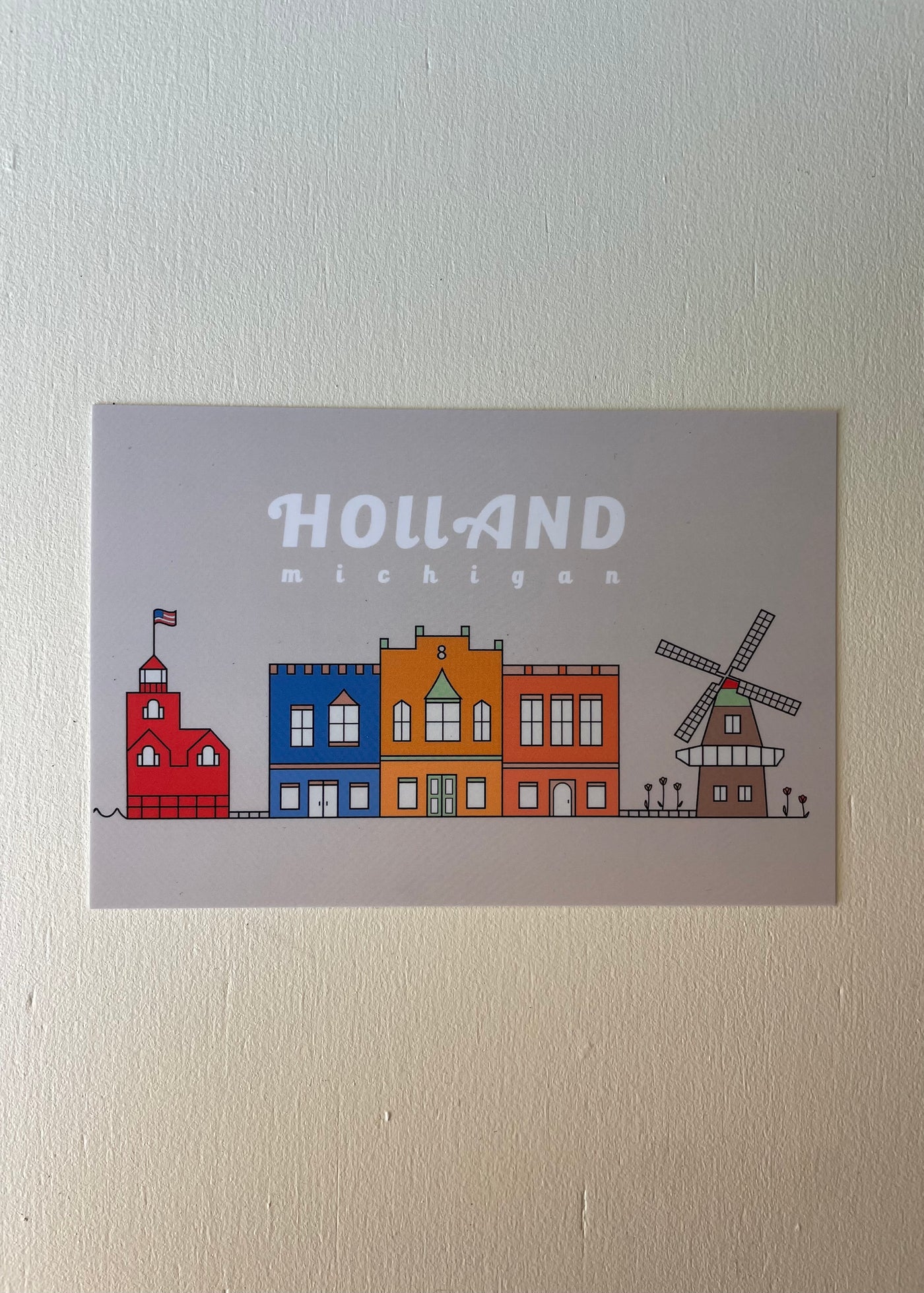 Holland Michigan Tan Postcard with imagery of downtown, big red lighthouse and a windmill.