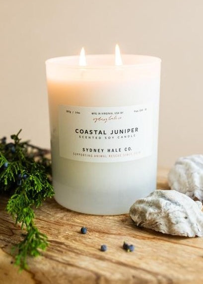 Candle in a frosted cream glass vessel