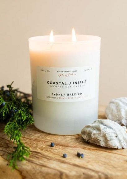 Candle in a frosted cream glass vessel