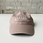 Tan baseball hat embroidered with Holland