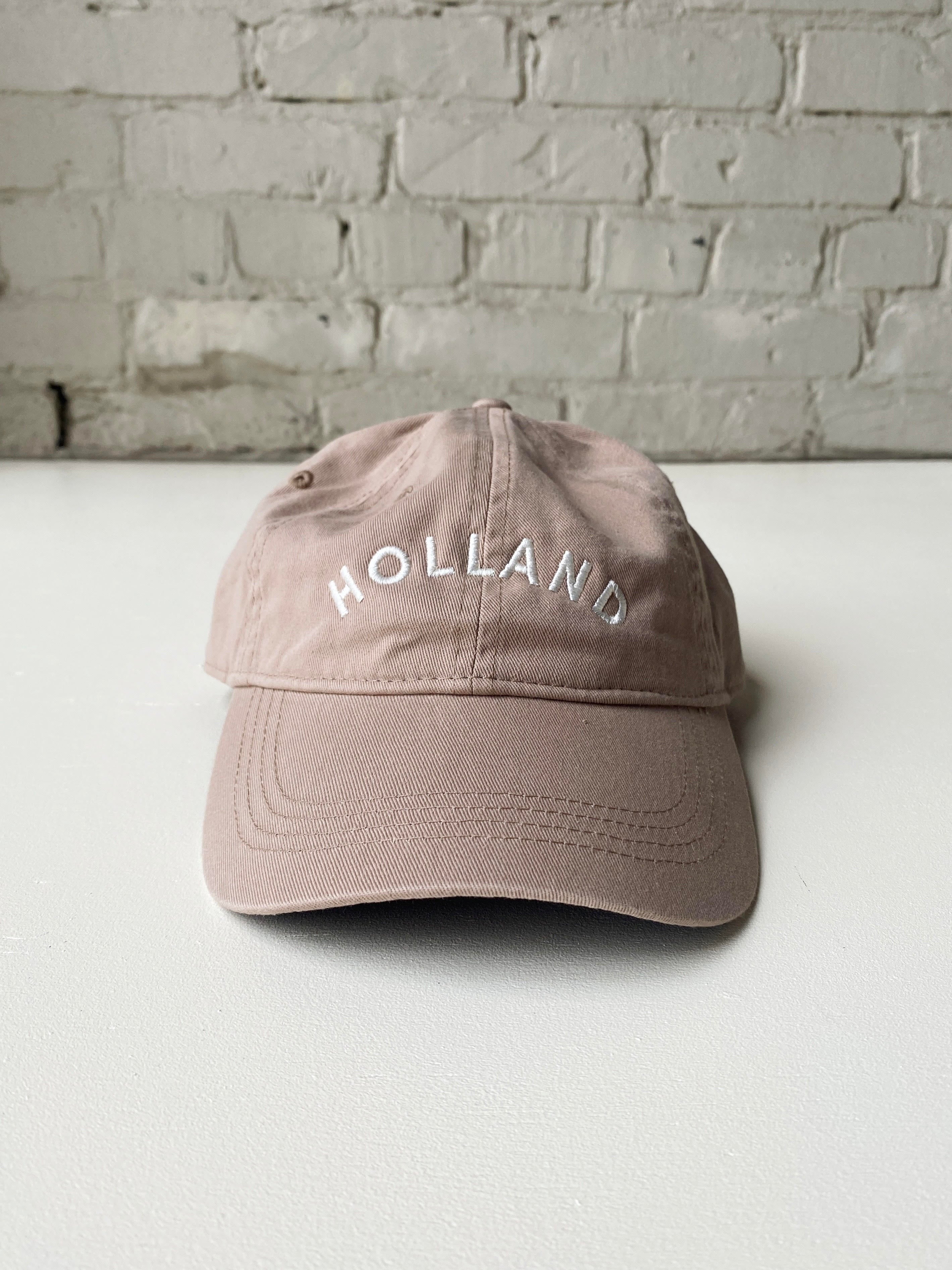 Tan baseball hat embroidered with Holland