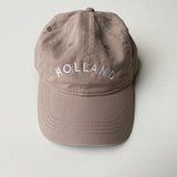 Tan baseball hat embroidered with Holland
