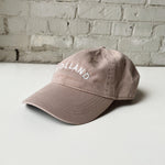 Tan baseball hat embroidered with Holland