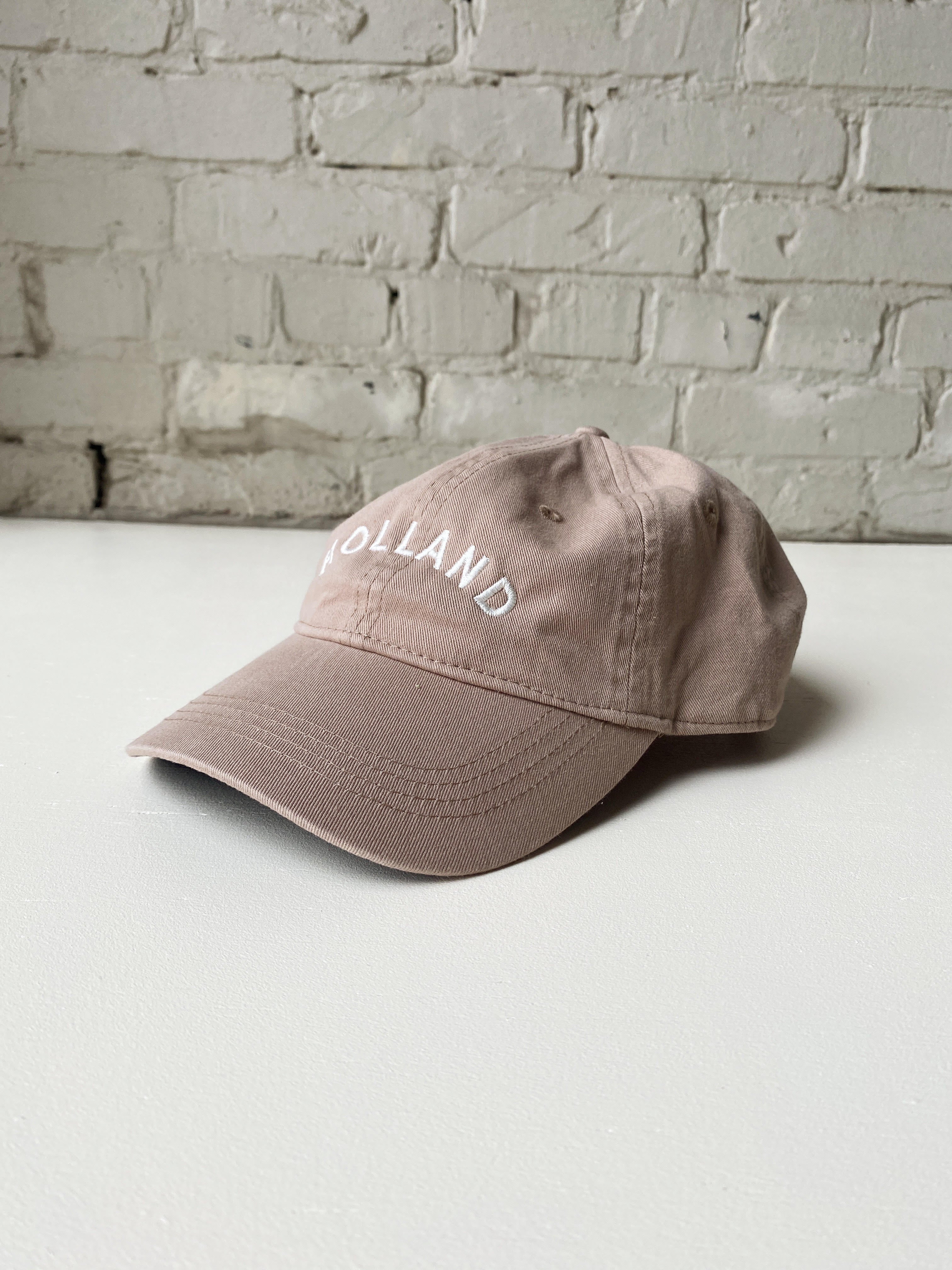 Tan baseball hat embroidered with Holland