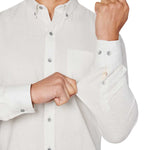 Man wearing White button up shirt and black jeans