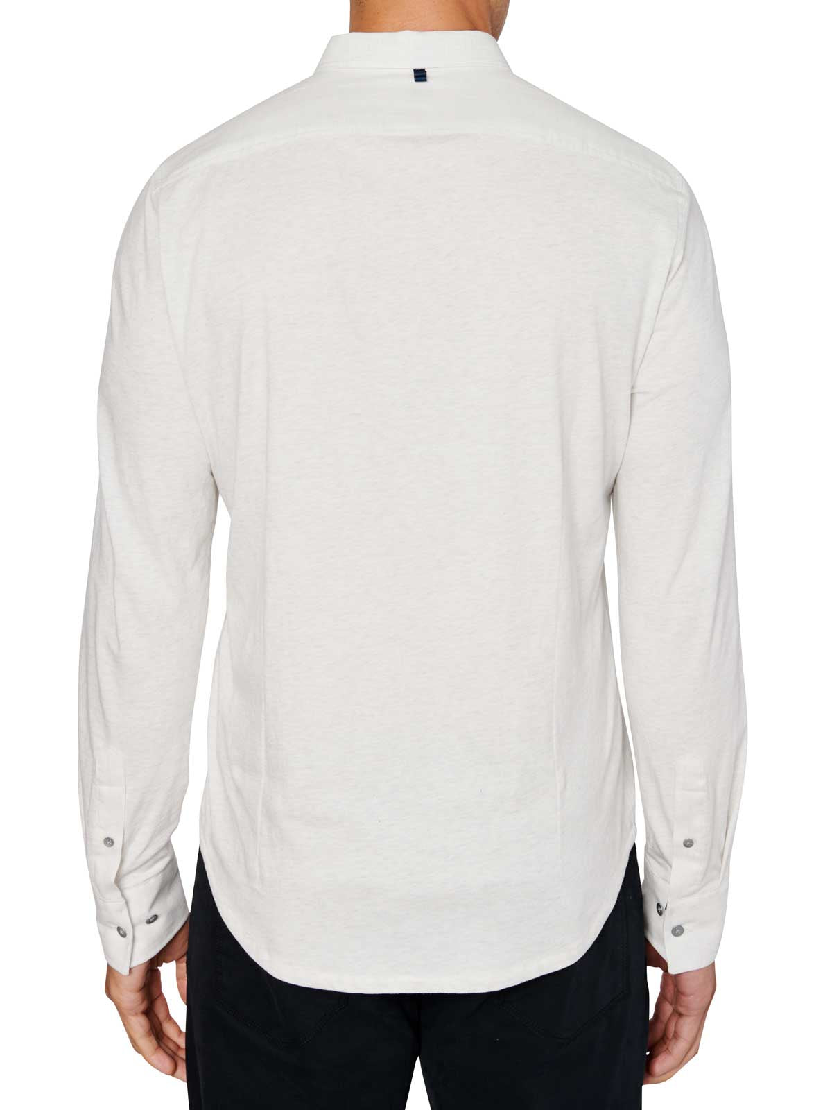 Man wearing White button up shirt and black jeans