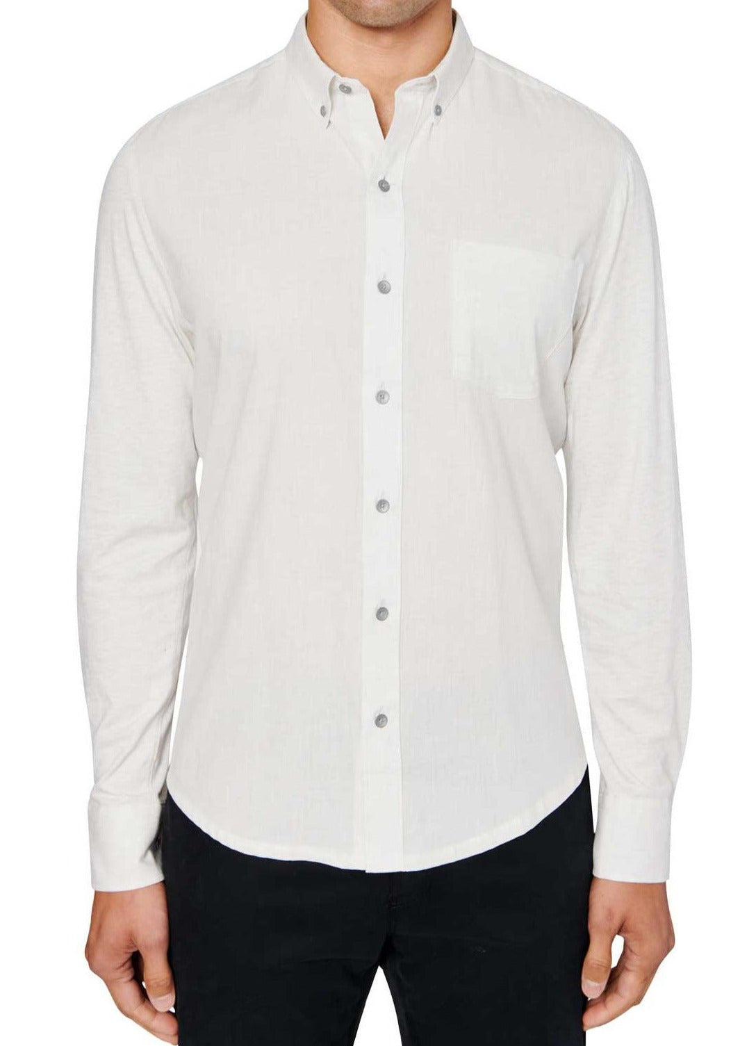Man wearing White button up shirt and black jeans