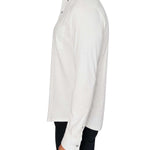 Man wearing White button up shirt and black jeans
