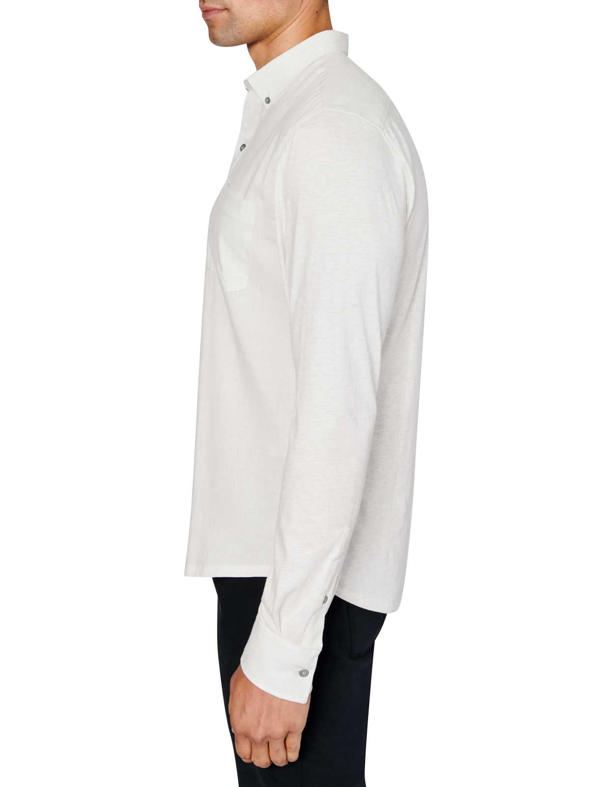 Man wearing White button up shirt and black jeans